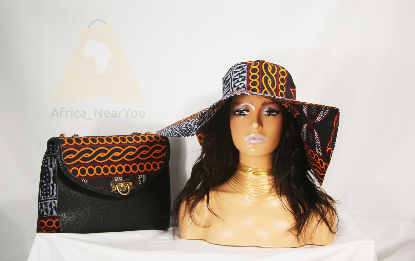 Elegant Fusion: Black Leather Handbag with African Print Accent